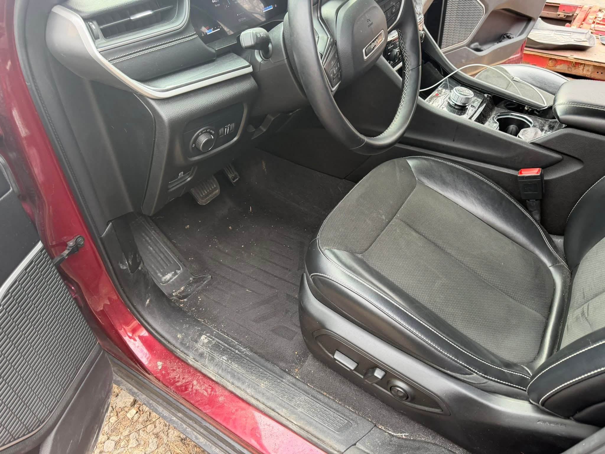 Before detailing on red SUV exterior covered in road grime